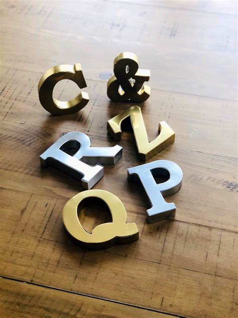 Mini metal letters cut custom from solid brass. . Small metal letters